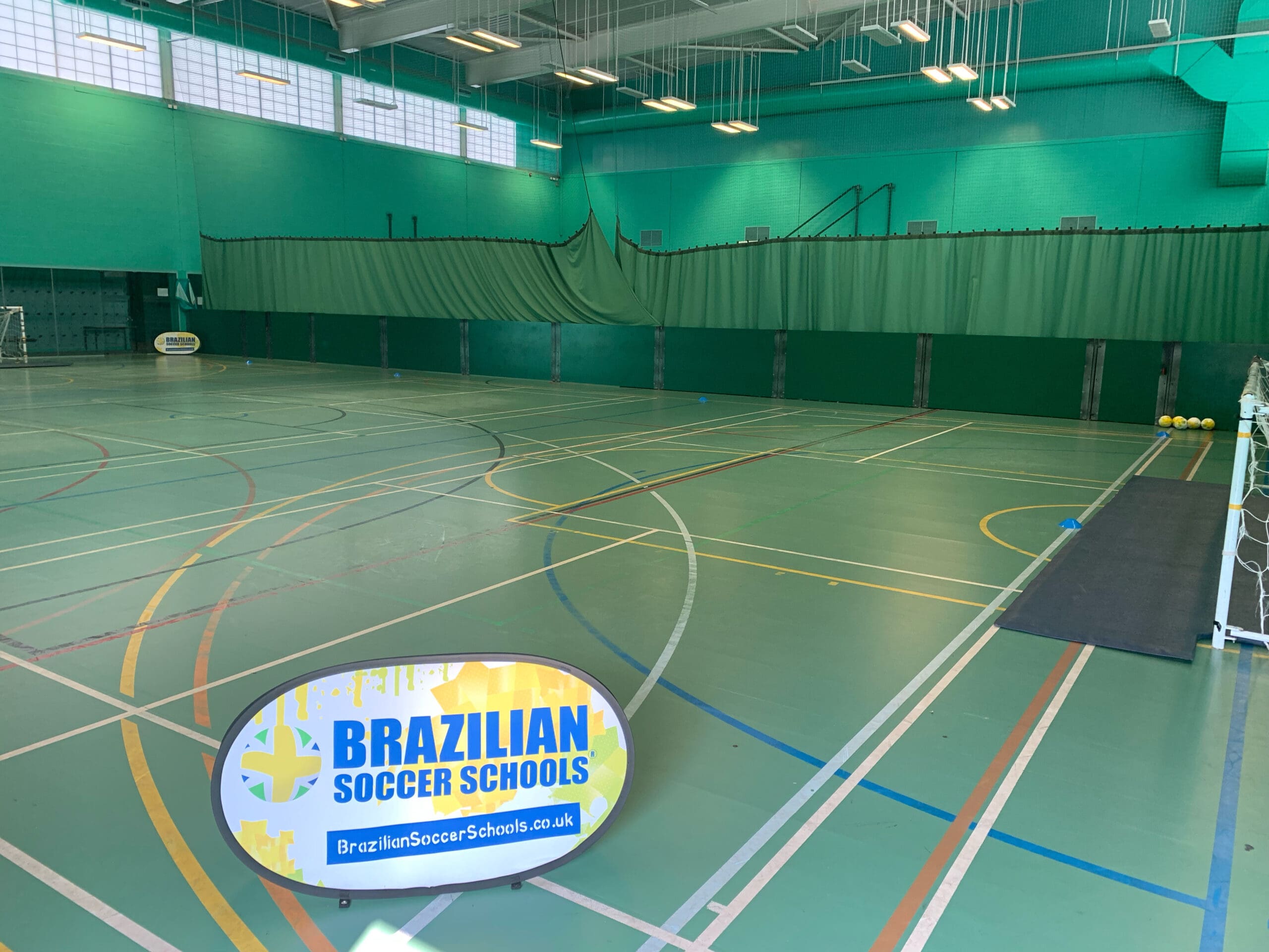 Girl controlling the football while playing at Brazilian Soccer Schools football training classes 