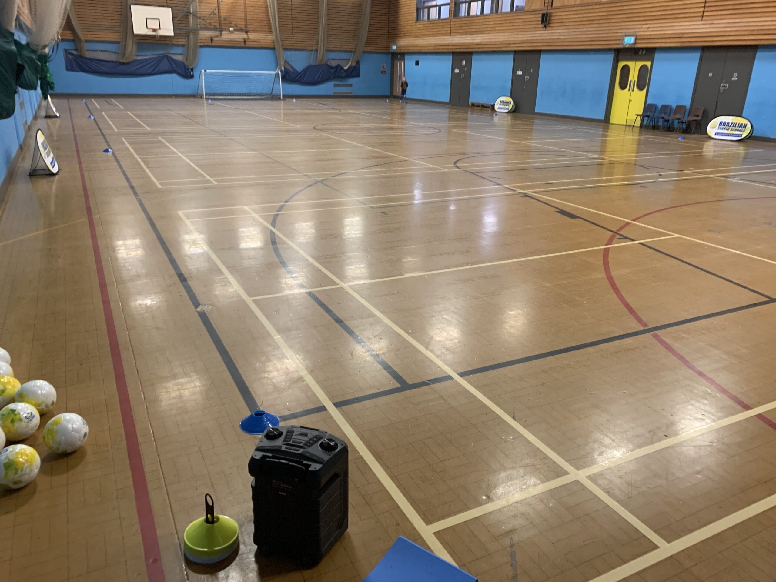 Girl controlling the football while playing at Brazilian Soccer Schools football training classes 