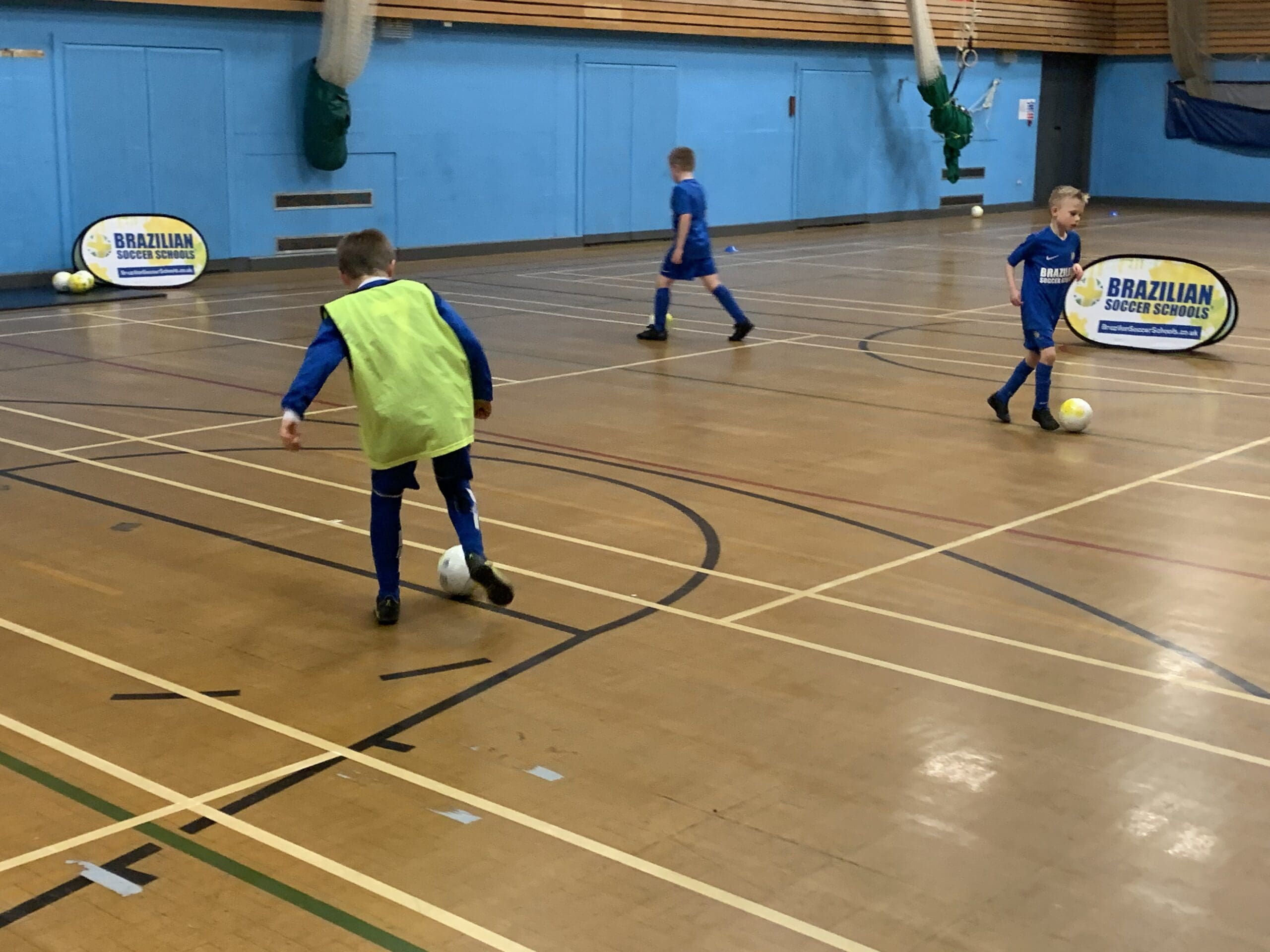 Player balancing a ball on his head at Brazilian Soccer Schools