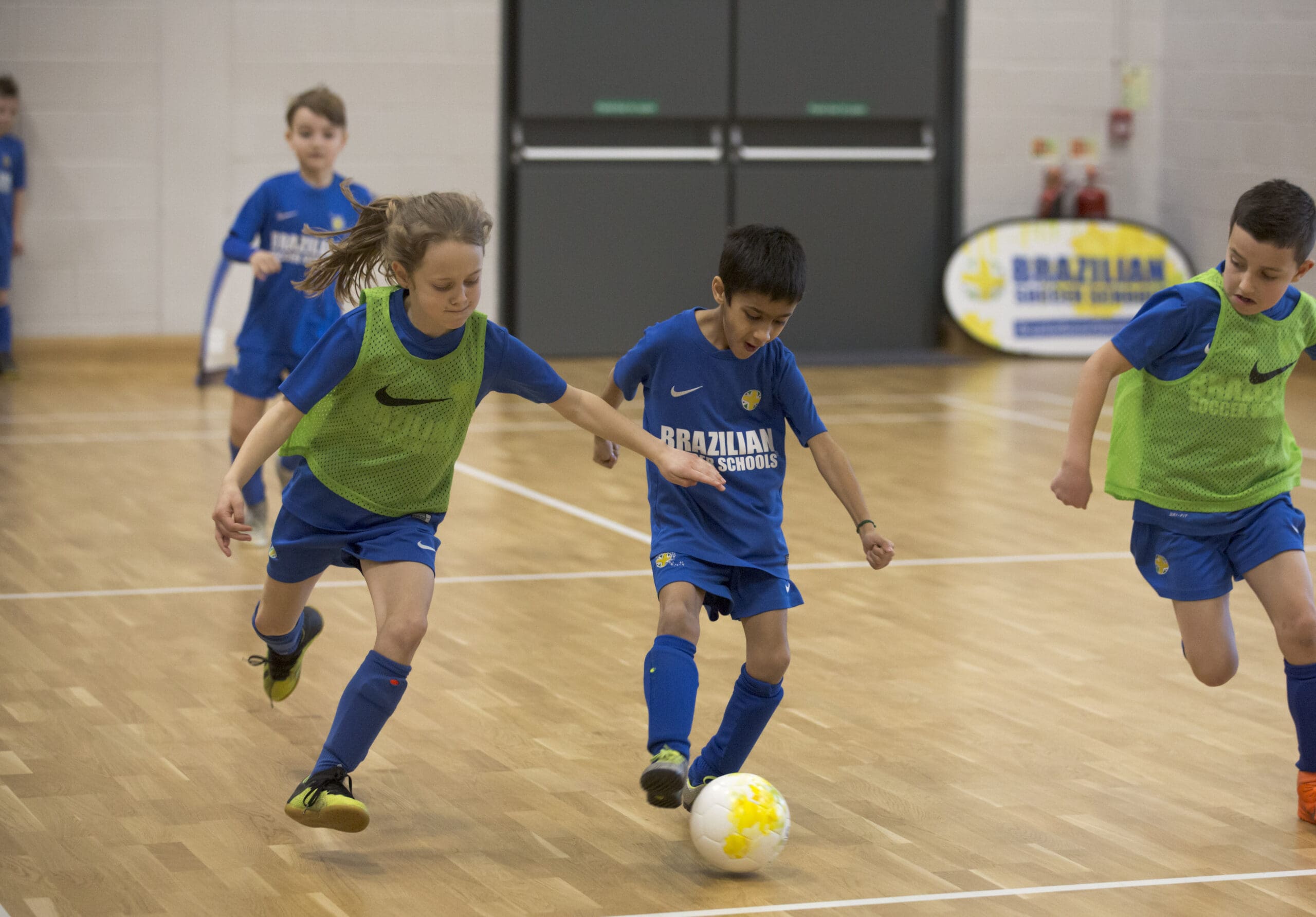 Kids playing football at Brazilian Soccer Schools