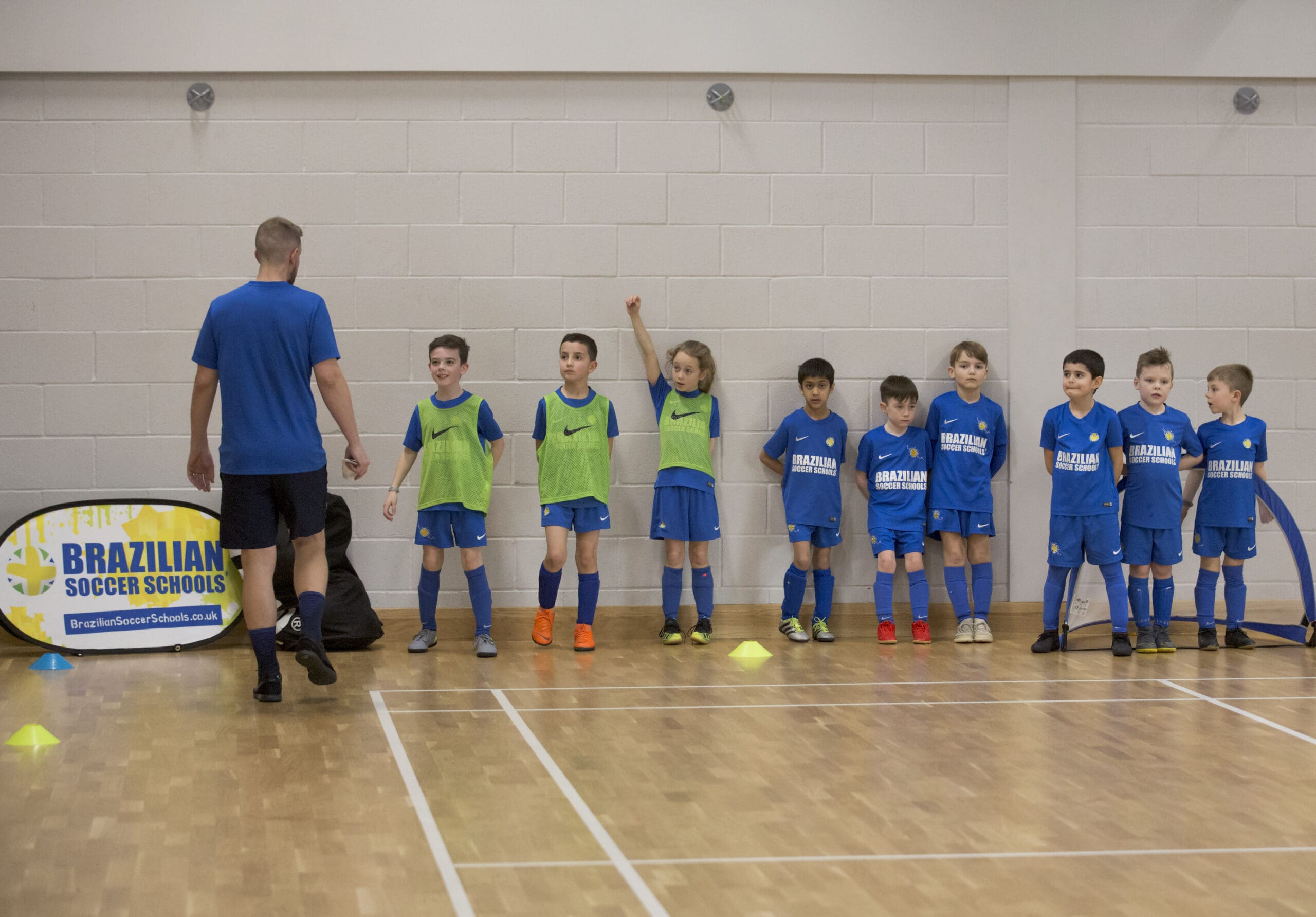 Girl controlling the football while playing at Brazilian Soccer Schools football training classes 